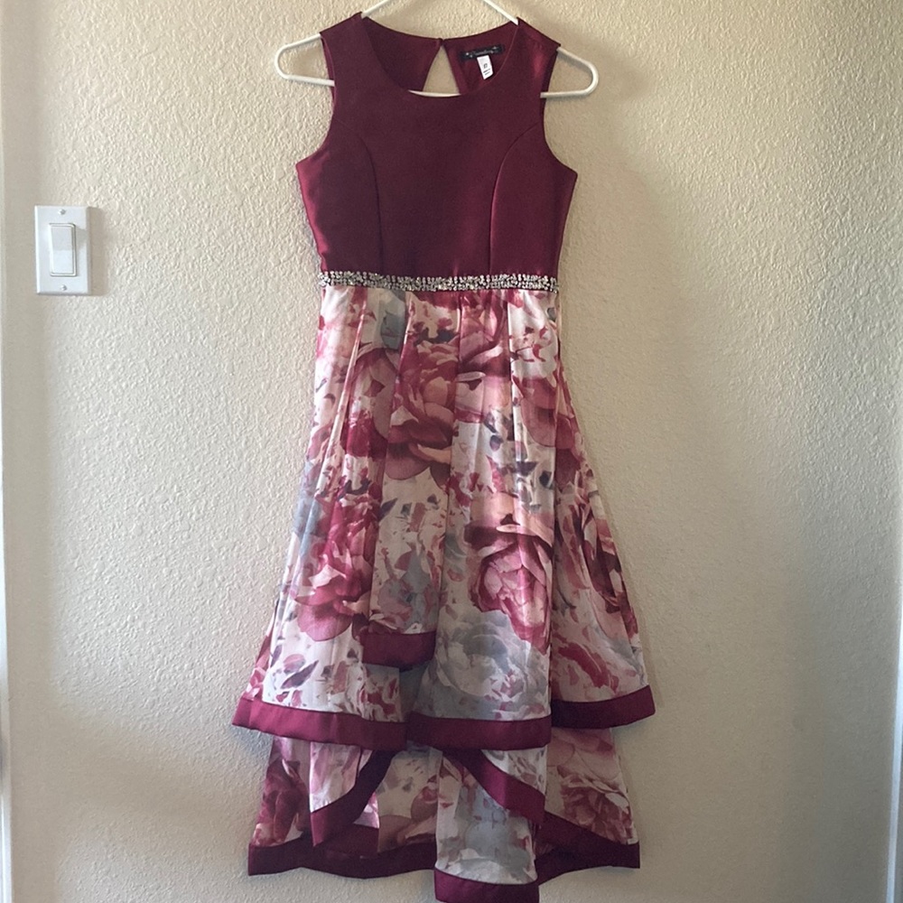 Xtraordinary sleeveless floral pleated Hi-Low dress. Girls size 12